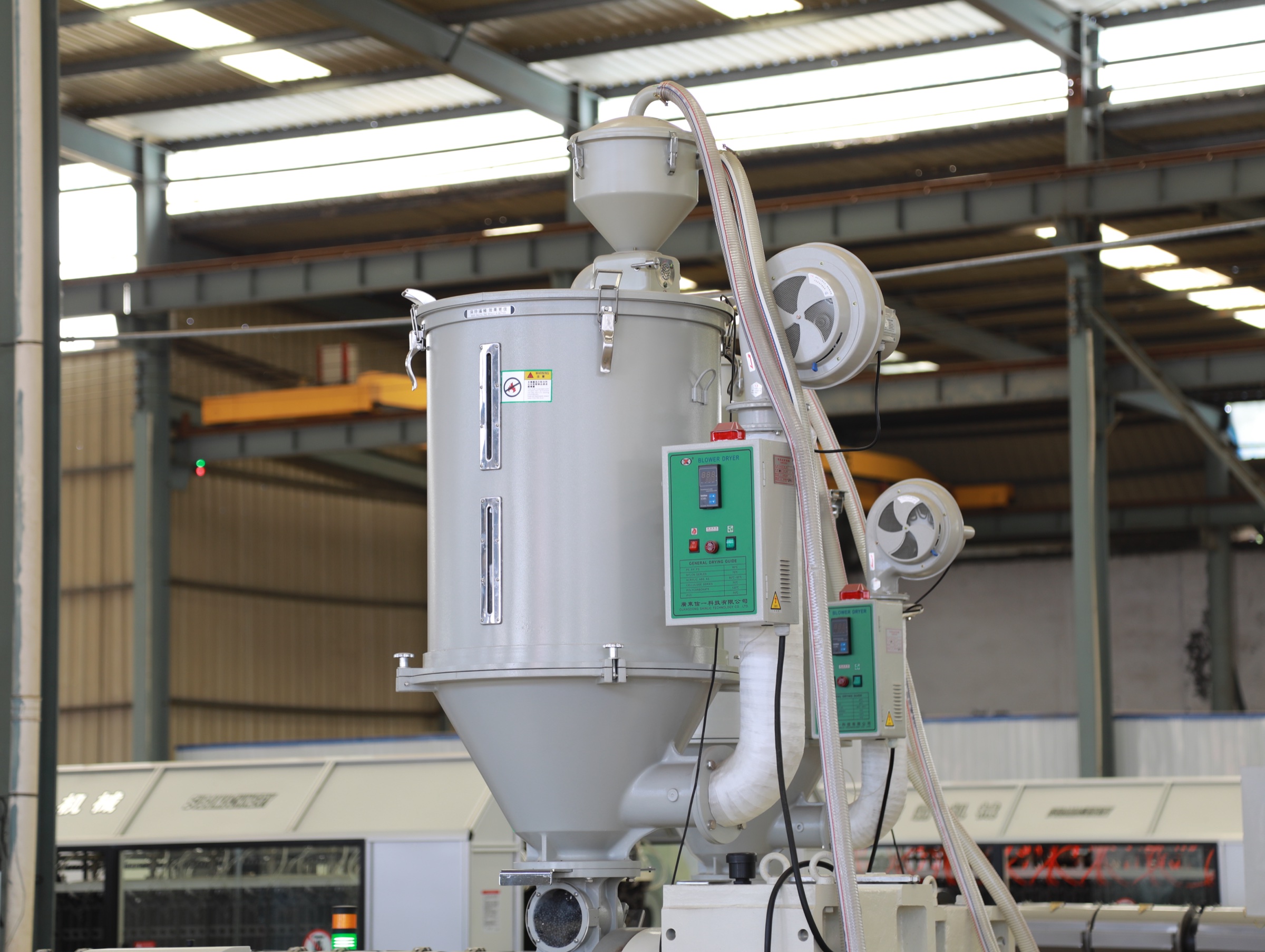 Die Head - Material is extruded from the extruder through the inner and outer dies of the double layer pipe die head - 2